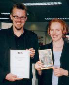 Clive and Hodders Anne Clark pose with
the TES Information Book of the Year award.